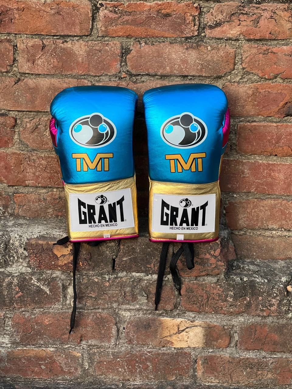 Custom blue and gold TMT Grant boxing gloves